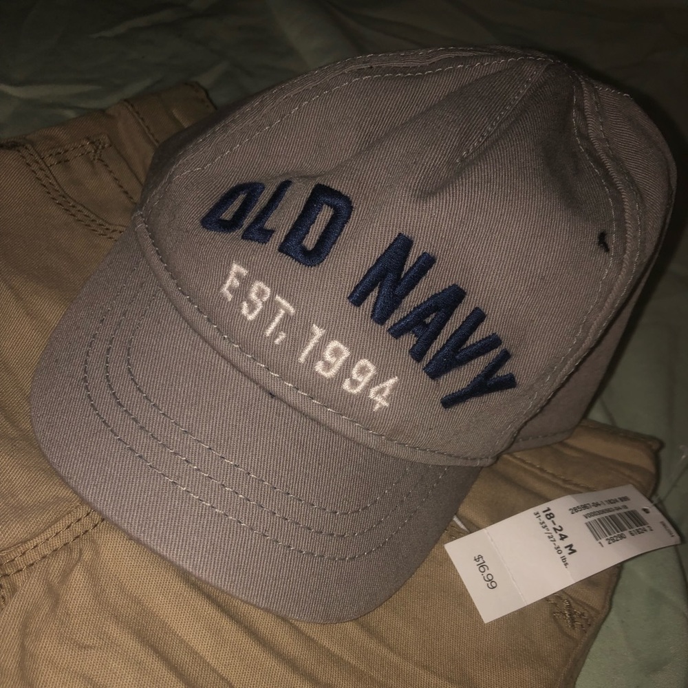 Brown slacks & Grey baseball hat